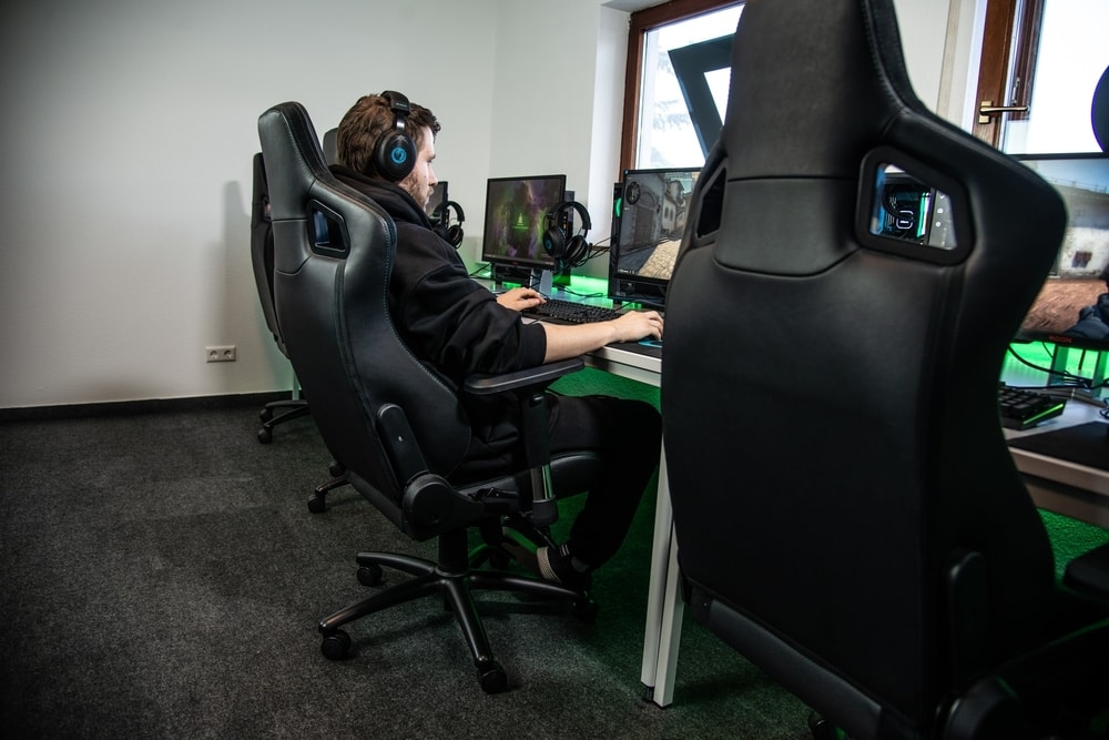 Man in a gaming chair playing on his PC